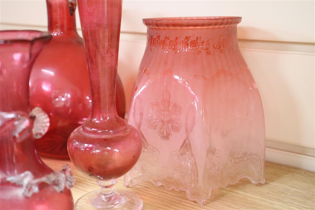 A collection of Victorian and later cranberry and ruby coloured glassware, ewer 18cm